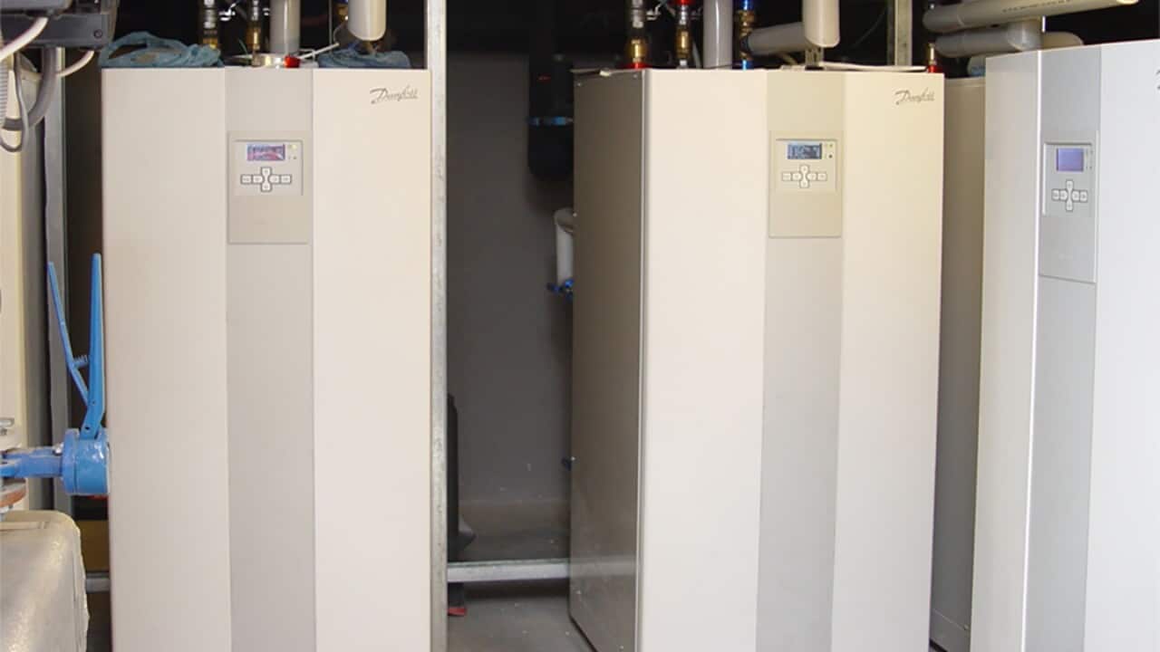 A Danfoss air source heat pump indoor unit with a built-in hot water storage tank.